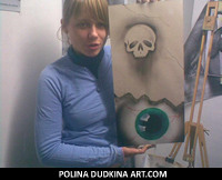 Polina holding one of her abstract airbrush paintings