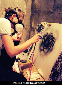 Polina working hard on a lion's head airbrush painting